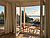 Wohnung 3: Traumhafter Blick durch die große geöffnete Fenstertür vom Wohnzimmer über die Terrasse auf den Hainer See.